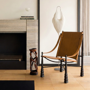 Luxury modern saddle leather lounge chair with carbon steel frame and elegant contemporary design