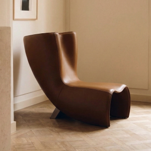 Luxury modern saddle leather lounge chair with stainless steel legs and contemporary design